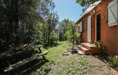 a group of benches sitting outside of a building at 2 Bedroom Lovely Home In Piscia Rossa in Afa