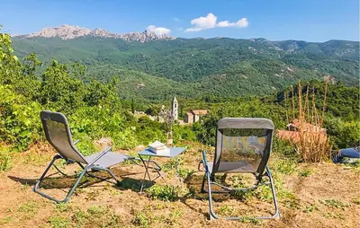 two chairs and a table on top of a mountain at Awesome Home In San-Gavino Di Carbini in San-Gavino-di-Carbini