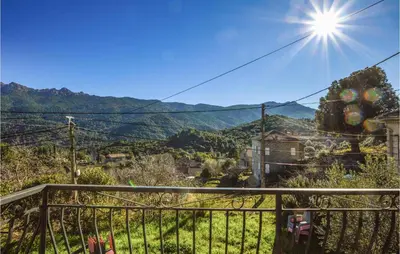 a view of the mountains from a balcony of a house at Awesome Home In San-Gavino Di Carbini in San-Gavino-di-Carbini