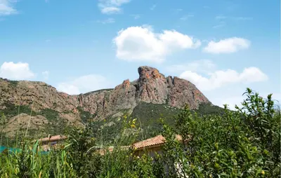 a mountain with a house in front of it at Stunning Home In Afa With Wifi in Afa