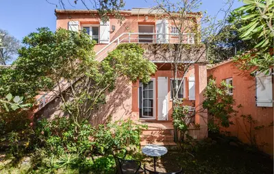an old brick building with a staircase in front of it at 2 Bedroom Stunning Apartment In Afa in Afa