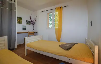 a bedroom with a bed and a window at 2 Bedroom Stunning Apartment In Afa in Afa