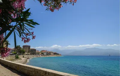 a view of a beach with blue water and buildings at 2 Bedroom Stunning Apartment In Afa in Afa