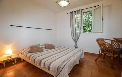 a bedroom with a bed and a window at 2 Bedroom Stunning Apartment In Afa in Afa