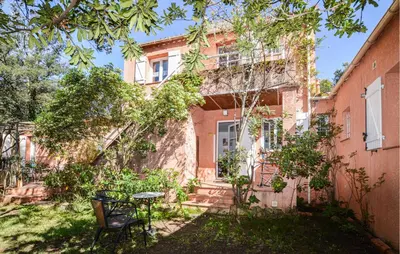an old building with a table in front of it at 2 Bedroom Stunning Apartment In Afa in Afa