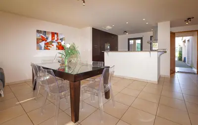 a dining room with a glass table and chairs at Beautiful Home In Sagone With Kitchen in Sagone