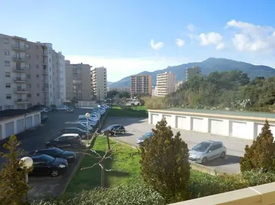 a parking lot with a bunch of cars parked at Appartement 3 chambres - 2 salles de bain - 6 personnes in Ajaccio