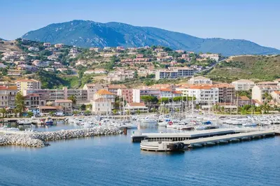 a marina with a bunch of boats in the water at Appartement avec terrasse 3 pièces - Vue mer - Plage 5 min à pied in Propriano