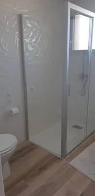 a bathroom with a shower and a toilet at Maison proche de la mer in Pianottoli-Caldarello