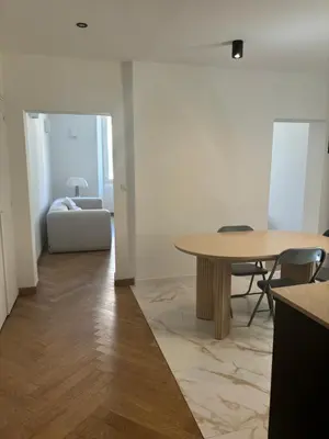 a living room with a table and a couch at Appartement Ajaccio hyper centre in Ajaccio