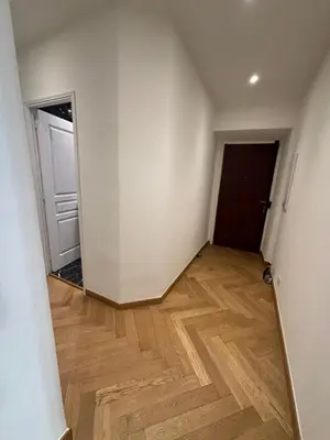 an empty room with a door and a wooden floor at Appartement Ajaccio hyper centre in Ajaccio