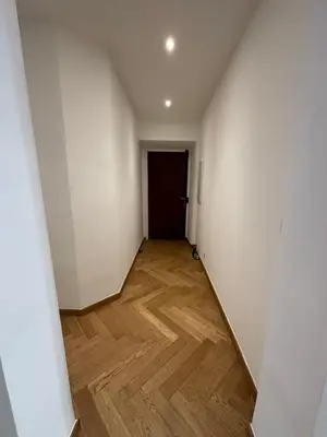 a hallway with white walls and a wooden floor at Appartement Ajaccio hyper centre in Ajaccio