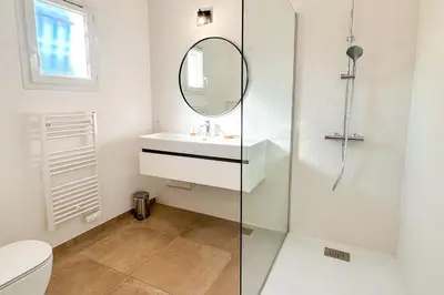 a bathroom with a sink and a mirror at Villa Amaredda Di Arasu in Sainte-Lucie de Porto-Vecchio