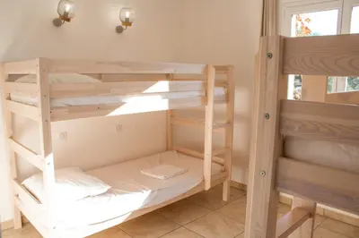 a bunk bed room with two bunk beds at Villa Ditalina Di Arasu in Sainte-Lucie de Porto-Vecchio