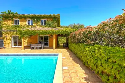 a house with a swimming pool in front of a house at Villa Ditalina Di Arasu in Sainte-Lucie de Porto-Vecchio