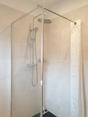 a shower with a glass door in a bathroom at U Caseddu di a Castagna Maison en pierre La Castagna Coti Chiavari in Coti-Chiavari