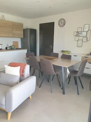a kitchen and dining room with a table and chairs at U Caseddu di a Castagna Maison en pierre La Castagna Coti Chiavari in Coti-Chiavari