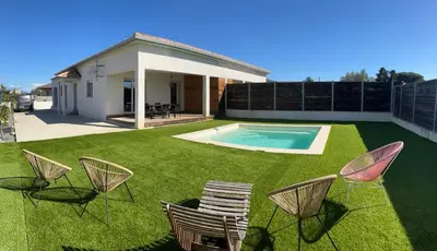 a yard with chairs and a swimming pool at Maison de Vacances Avec Piscine Privée en Corse, BORGO in Borgo