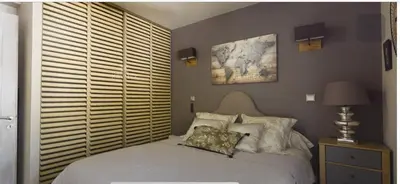 a bedroom with a bed with pillows on it at Casa Mulinchese entre Mer et Montagne in Volpajola