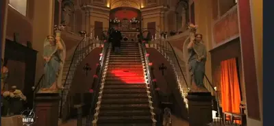a person walking up a spiral staircase in a building at Casa Mulinchese entre Mer et Montagne in Volpajola