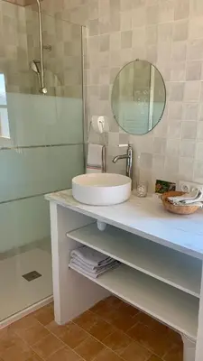 a bathroom with a sink and a mirror at Casa1850 in Lama