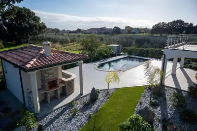 an overhead view of a house with a swimming pool at Rez de maison neuve Piscine WiFi Poolhouse en Pierre in Penta-di-Casinca