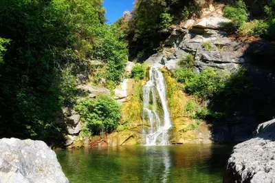 a waterfall in the middle of a body of water at Soleil & mer sur la Costa Verde in Cervione