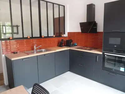 a kitchen with a sink and a microwave at Soleil & mer sur la Costa Verde in Cervione