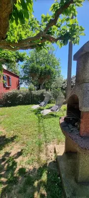 a group of chairs in a yard with a fireplace at Résidence bord de mer I Querci in Poggio-Mezzana