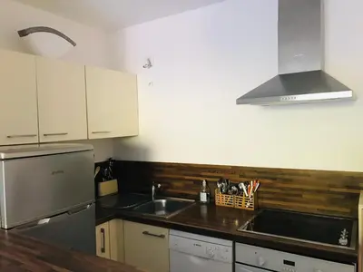 a kitchen with a sink and a counter top at Rez de chaussez de villa 4 personnes mer in Sorbo-Ocagnano