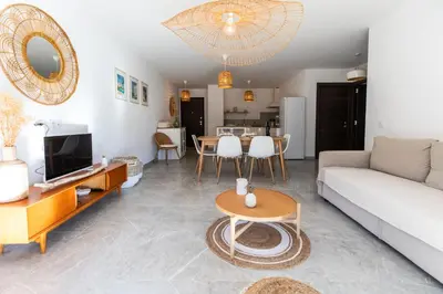 a living room with a couch and a table at Appartement 4-6 pers Bonifacio in Bonifacio