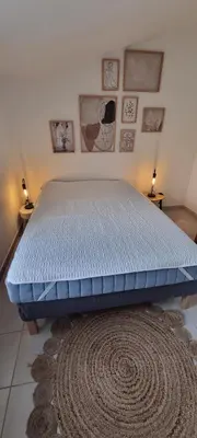 a bed in a room with a blue mattress at Corse Villa bord de mer in Cervione