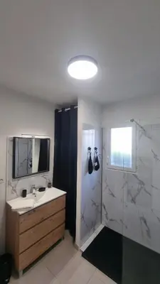 a bathroom with a sink and a shower at Corse Villa bord de mer in Cervione