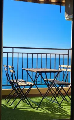 a view of the ocean from a train window at VUE MER EXCEPTIONNELLE !! Studio calme et lumineux sur la prestigieuse route des Sanguinaires à Ajaccio in Ajaccio