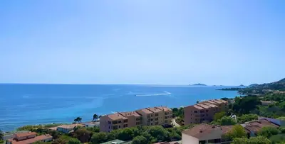 an aerial view of a city and the ocean at VUE MER EXCEPTIONNELLE !! Studio calme et lumineux sur la prestigieuse route des Sanguinaires à Ajaccio in Ajaccio