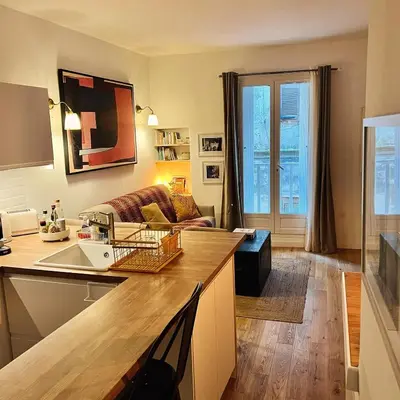 a kitchen and living room with a couch at Joyau au cœur de la vieille ville de Bonifacio in Bonifacio