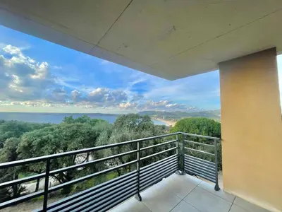 a balcony with a view of the ocean at Appartement Tour d'Omigna Cargèse in Cargèse
