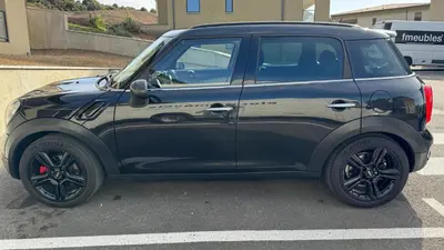 a black suv parked in a parking lot at Appartement récent, tout confort , vue mer, plage à 5min in Propriano