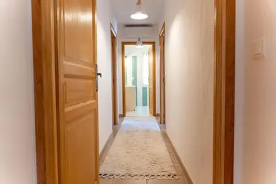 a hallway with an open door and a hallwayngthngthngthngthngthngthngth at Villa Tizzano Vue Mer in Sartène