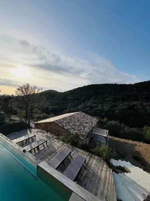 a house with a swimming pool with a mountain at 