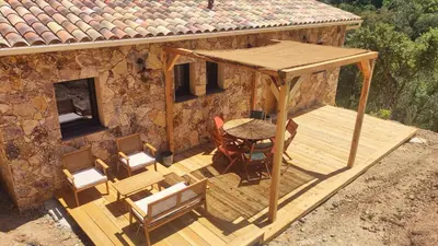 an overhead view of a deck with a table and chairs at 