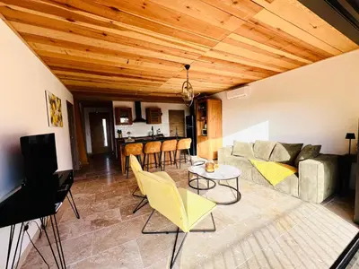 a living room with a couch and a table at 