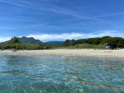 a view of a beach from the water at Appartement T3 bord de mer résidence Aqualinda E55 in Poggio-Mezzana