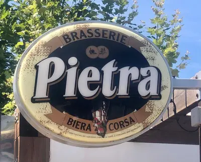 a sign for a pepa restaurant on a building at Villa bord de mer avec piscine 200 métres plage in Zonza
