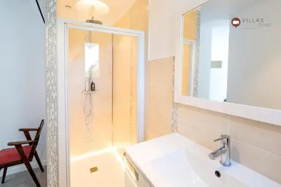 a bathroom with a sink and a shower at Villa bord de mer avec piscine 200 métres plage in Zonza