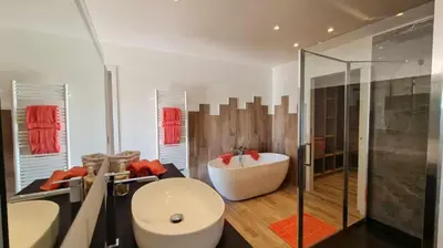 a bathroom with a tub and a sink and a shower at Proche porticcio, Coup de cœur asuré,Appartement de standing, rez de villa 6 couchages, climatisé à 150m de la plage, terrains de tennis in Grosseto-Prugna