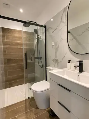 a bathroom with a shower and a toilet and a sink at Villa luxury vue mer à 300m du centre ville terrasse,jardin,parking privé in Porto-Vecchio