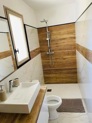 a bathroom with a sink and a toilet at Mini maison entre mer et montagne in Aléria