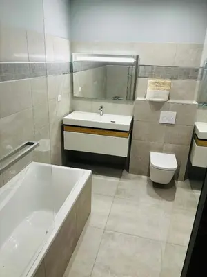 a bathroom with a tub and a sink and a toilet at Appartement moderne à Ajaccio de 45 m² avec terrasse vue mer in Ajaccio