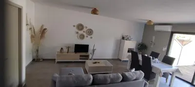 a living room with a couch and a table at Appartement Lelia in Sotta